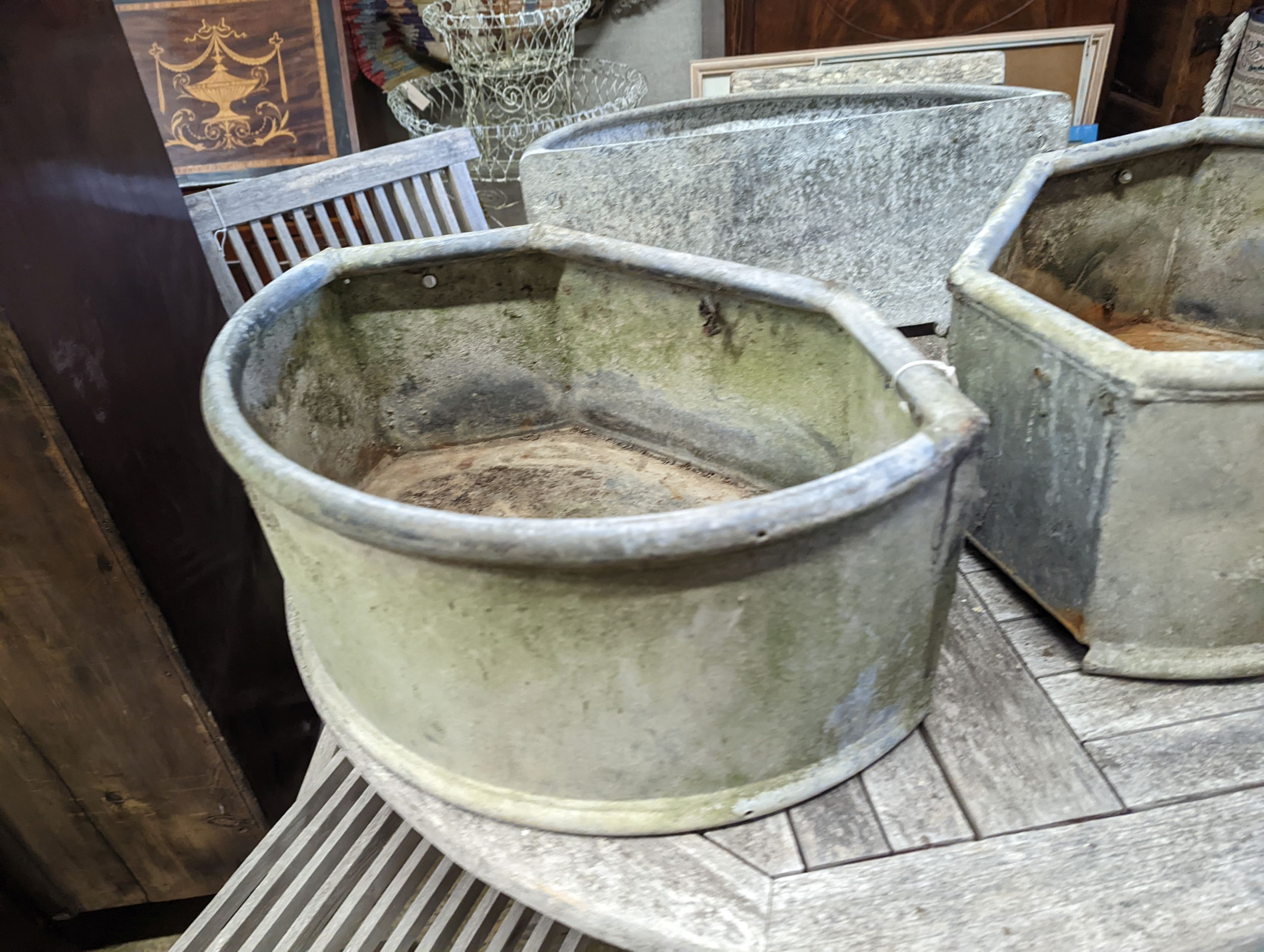 Three galvanised metal troughs/planters, largest width 56cm, depth 29cm